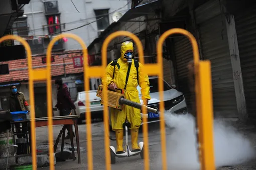 UHAN, CHINA — MARCH 11 2020: A volunteer on a personal transporter disinfects a community in Wuhan in central China's Hubei province Wednesday, March 11, 2020.- PHOTOGRAPH BY Feature China / Barcroft Studios / Future Publishing (Photo credit should read Feature China/Barcroft Media via Getty Images