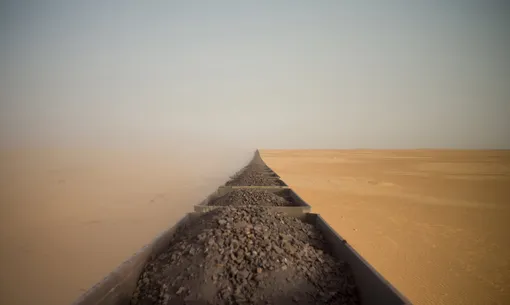 Travel: Riding a Saharan Freight Train byAdrian Guerin (Australia) Taken from the top of the rear carriage of the iron-ore train in Mauritania as it was making its 700km long journey from the coastal town of Nouadhibou to the Saharan wilderness of Zouérat. Stretching 2.5km, it’s one of the longest trains in the world transporting more than 200 carriages loaded with rocksPhotograph: Adrian Guerin