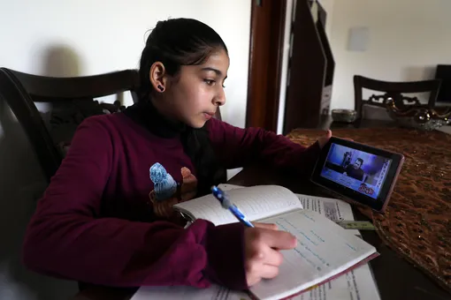 Palestinian student following up an electronic lesson on the Education radio, during school students vacation as a preventive measure amid fears of the spread of the novel coronavirus, in Gaza city, on March 15, 2020. (Photo by Majdi Fathi/NurPhoto via Getty Images)