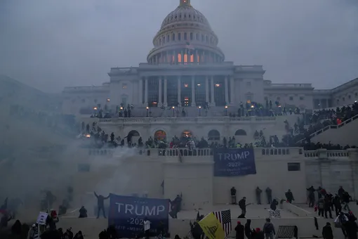 Police officers stand guard as supporters of U.S. President Donald Trump gather in front of the U.S. Capitol Building in Washington, U.S., January 6, 2021. REUTERS/Leah Millis