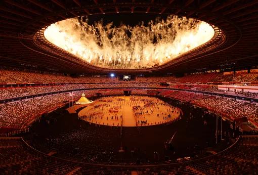 Tokyo 2020 Olympics — The Tokyo 2020 Olympics Opening Ceremony — Olympic Stadium, Tokyo, Japan — July 23, 2021. General view inside the stadium after the lighting the Olympic cauldron at the opening ceremony. (Edited)