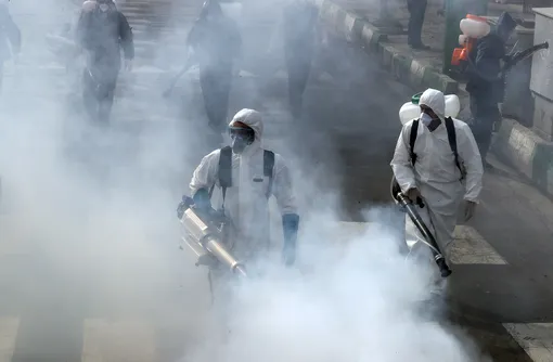 Iranian Firefighters disinfect streets in an effort to stop the wild spread of coronavirus COVID-19 in Tehran, Iran, 13 March 2020. According the last report by the Ministry of Health, 11,364 people were diagnosed with the Covid-19 coronavirus and 514 people have died in Iran. EPA-EFE/ABEDIN TAHERKENAREH