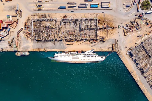 BEIRUT, LEBANON — AUGUST 21: An aerial view of a capsized cruise ship, damaged in the Beirut Port blast, on August 21, 2020 in Beirut, Lebanon. The explosion at Beirut's port killed over 200 people, injured thousands, and upended countless lives. There has been little visible support from government agencies to help residents clear debris and help the displaced. As residents continue to clean up after the Beirut port explosion, Lebanon has issued a two week lockdown starting August 21 after Coronavirus cases surged in the aftermath of the explosion. (Photo by Haytham Al Achkar/Getty Images)