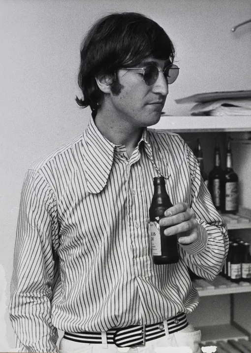 GERMANY — JUNE 01: Photo of John LENNON and BEATLES; John Lennon, posed, holding beer, on final German tour КРЕДИТ