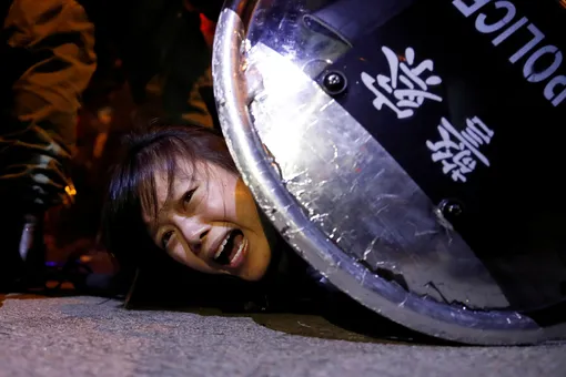 An anti-extradition bill protester is detained by riot police during a protest outside Mong Kok police station, in Hong Kong, China September 2, 2019. REUTERS/Tyrone Siu