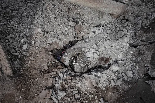 TAAL VOLCANO ISLAND, PHILIPPINES — JANUARY 14: The carcass of a horse is seen buried in volcanic ash from Taal Volcano's eruption on January 14, 2020 in Taal Volcano Island, Batangas province, Philippines. The Philippine Institute of Volcanology and Seismology raised the alert level to four out of five, warning that a hazardous eruption could take place anytime, as authorities have evacuated tens of thousands of people from the area. An estimated $10 million worth of crops and livestock have been damaged by the on-going eruption, according to the country's agriculture department. (Photo by Ezra Acayan/Getty Images)