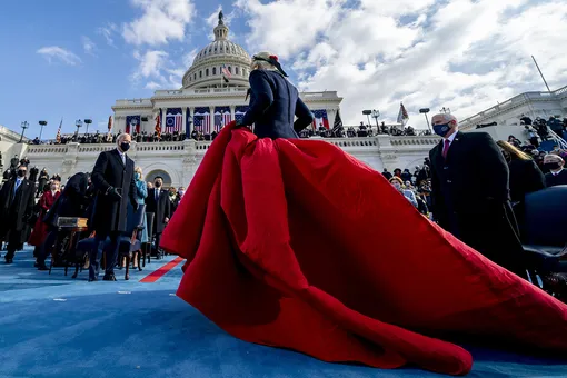 WASHINGTON, DC — JANUARY 20: U.S. President-elect Joe Biden (L) and Vice President Mike Pence (R) watch as Lady Gaga steps off the stage after singing the national anthem on the West Front of the U.S. Capitol on January 20, 2021 in Washington, DC. During today's inauguration ceremony Joe Biden becomes the 46th president of the United States.