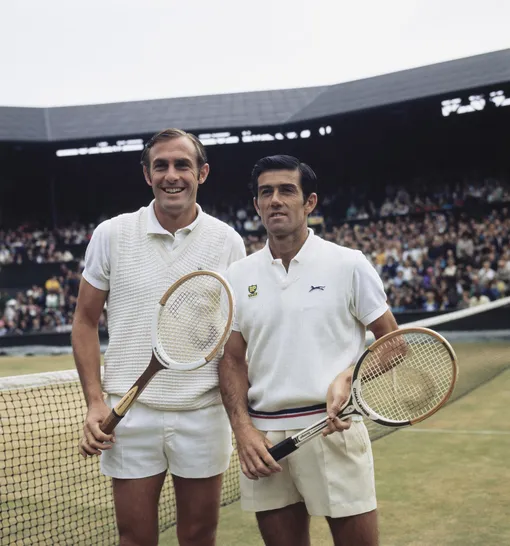 John Newcombe of Australia and compatriot Ken Rosewall pose for photographs before their Men's Singles Final match at the Wimbledon Lawn Tennis Championship on 4th July 1970 at the All England Lawn Tennis and Croquet Club in Wimbledon, London, England. (Photo by )