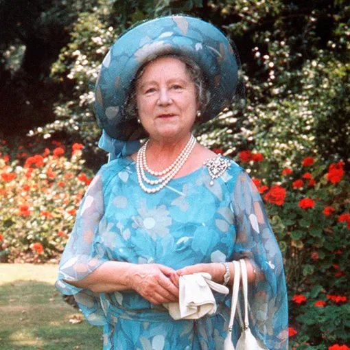 Royalty — The Queen Mother 75th Birthday — Clarence HouseThe Queen Mother walking in the grounds of her residence, Clarence House, with a corgi dog on her 75th birthday. (Photo by PA Images via Getty Images)