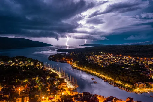 Wild Night in the Adriatic| Nature CommendedStari Grad, on Hvar Island, with fork lightning and a waterspout on the open seaPhotograph: Miroslav Zadravec/Drone Photography Awards 2021