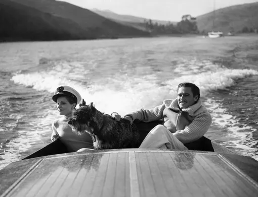 Errol Flynn and Lily Damita Boating(Original Caption) Errol Flynn and his first wife, the French film star Lily Damita. (Photo by