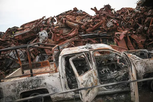 A junkyard littered with the husks of vehicles that were set on fire by sicarios during the Black Thursday attack
