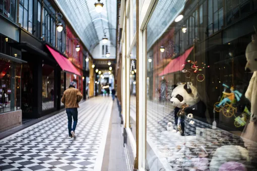 epa08298256 A man walks inside an empty covered passage on the day 2 of the measures to contain the spread of coronavirus SARS-CoV-2 which causes the Covid-19 disease, in Paris, France, 16 March 2020. French Prime Minister Edouard Philippe announced on 14 March 2020 that all places that are not essential to French living, including restaurants, cafes, cinemas and clubs, will be closed from 15 March 2020 until further notice. President Macron announced the closing of schools, high schools and nurseries from 16 March 2020 on. EPA-EFE/YOAN VALAT