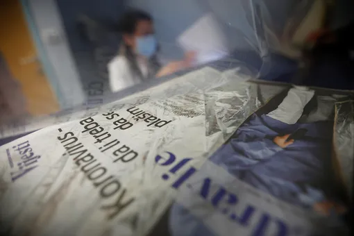 DATE IMPORTED:March 16, 2020A medical worker signs in a patient for exams behind a plastic curtain after the government limits the number of people in public places to prevent coronavirus (COVID-19) threat in Podgorica, Montenegro March 16, 2020. REUTERS/Stevo Vasiljevic