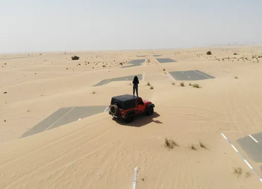 Desert roads lie almost completely hidden — as aerial images show them being swallowed up by wind-blown sand. Just a single car can be seen trying to cross the tarmac near Dubai as the surrounding dunes threaten to cover them up entirely.Nov 2020