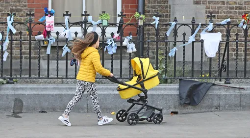 A young girl walks past tributes to deceased children at the site of a former Magdalene Laundry on Dublin's Sean McDermott street. Victims of clerical sexual abuse have called on the Pope to deliver a plan of action to tackle child abuse scandals. During his two-day visit to Ireland, Pope Francis begged forgiveness for the crimes of the Church. But campaigners urged him to take that one step further and take concrete action to solve the issue. (Photo by Niall Carson/PA Images via Getty Images)