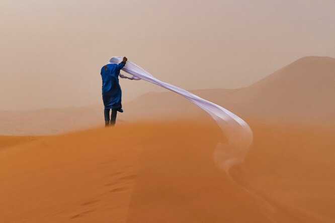 People and nature second place: Tom Overall, AustraliaA guide in the Sahara desert endures a sand stormPhotograph: Tom Overall/TNC photo contest 2021