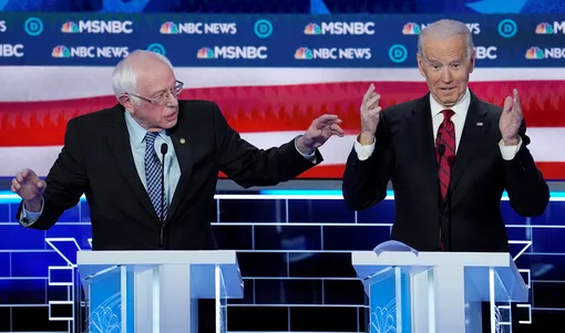 DATE IMPORTED:February 20, 2020Senator Bernie Sanders speaks as former Vice President Joe Biden reacts during the ninth Democratic 2020 U.S. Presidential candidates debate at the Paris Theater in Las Vegas Nevada, U.S., February 19, 2020. REUTERS/Mike Blake TPX IMAGES OF THE DAY
