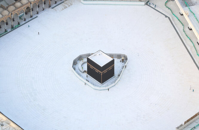 An aerial view shows an empty white-tiled area surrounding the Kaaba in Mecca's Grand Mosque, on March 6, 2020. — An eerie emptiness enveloped the sacred Kaaba in Mecca's Grand Mosque, Islam's holiest site, where attendance at Friday prayers was hit by measures to protect against the deadly new coronavirus. (Photo by Bandar ALDANDANI / AFP)