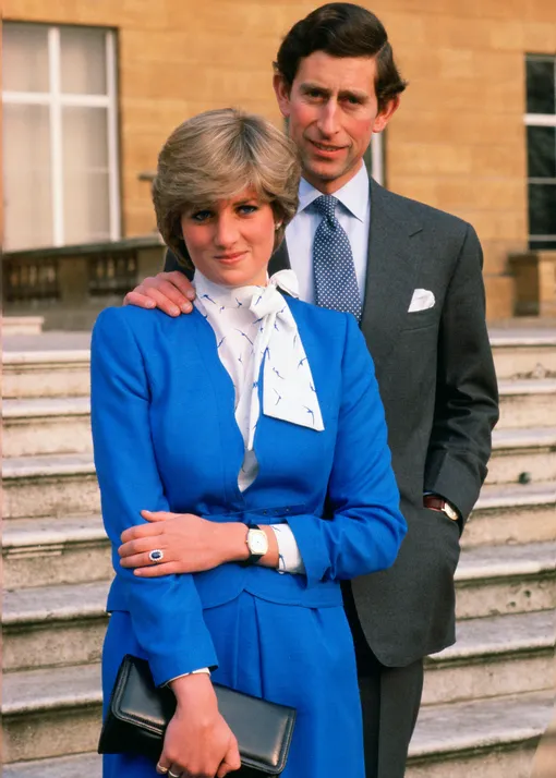 GREAT BRITAIN — FEBRUARY 24: Lady Diana Spencer (later to become Princess of Wales) reveals her sapphire and diamond engagement ring while she and Prince Charles, Prince of Wales pose for photographs in the grounds of Buckingham Palace following the announcement of their engagement 1981