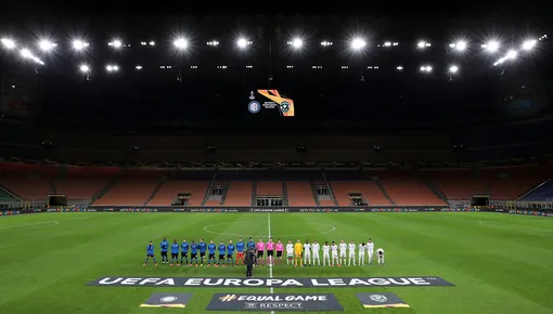Soccer Football — Europa League — Round of 32 Second Leg — Inter Milan v Ludogorets — San Siro, Milan, Italy — February 27, 2020 The teams line up before the match in an empty stadium after fans were not allowed in over coronavirus fears Emilio Andreoli/Pool via Reuters