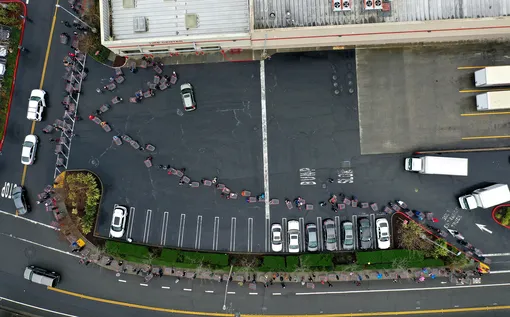 Coronavirus Pandemic Causes Climate Of Anxiety And Changing Routines In AmericaNOVATO, CALIFORNIA — MARCH 14: Hundreds of people line up to enter a Costco store on March 14, 2020 in Novato, California. Some Americans are stocking up on food, toilet paper, water and other items after the World Health Organization (WHO) declared Coronavirus (COVID-19) a pandemic. (Photo by Justin Sullivan/Getty Images)