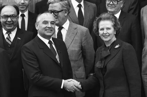 Soviet Politburo member Mikhail Gorbachev shakes hands with British Prime Minister Margaret Thatcher at Chequers on December 16, 1984.