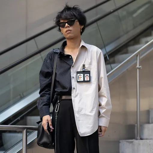 Гость Недели мужской моды в Нью-Йорке в рубашке Prada, июль 2018