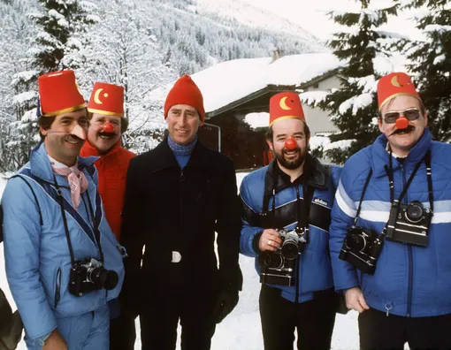 KLOSTERS, SWITZERLAND — JANUARY 24: Prince Charles With Members Of The Press In Klosters, Switzerland Who Are Returning His Joke By Wearing Joke Hats And Noses (he'd Previously Worn A Disguise To Fool The Press Corp). Left To Right : Steve Wood (daily Express) James Whitaker (the Sun) Ken Lennox (daily Star) Arthur Edwards (the Sun) (Photo by )