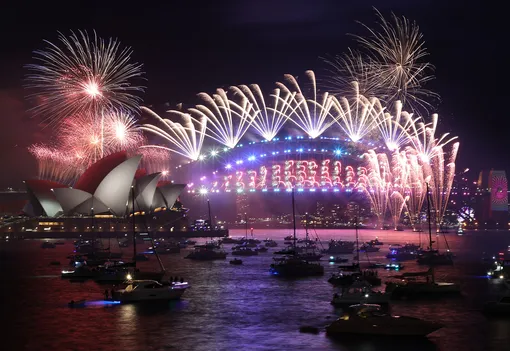 Richard Milnes/ShutterstockNew Year's Eve celebrations, Sydney, Australia — 01 Jan 2022New Year's Eve midnight fireworks looking at the Sydney Opera House and Sydney Harbour Bridge viewed from Mrs Macquaires Point, Royal Botanic Garden Sydney.