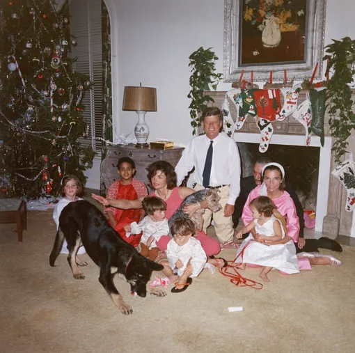 U.S. President John F. Kennedy (1917 — 1963) (C) and First Lady Jacqueline Kennedy (1929 — 1994) pose with their family on Christmas Day at the White House, Washington, D.C., December 25, 1962. (L-R): Caroline Kennedy, unidentified, John F. Kennedy Jr. (1960 — 1999), Anthony Radziwill (1959 — 1999), Prince Stanislaus Radziwill, Lee Radziwill, and their daughter, Ann Christine Radziwill. (Photo by )