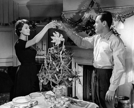 «Sophia Loren and William Holden toasting near a Christmas tree in a scene of the movie The Key by Carol Reed. London (United Kingdom), 1958. (Photo by )»