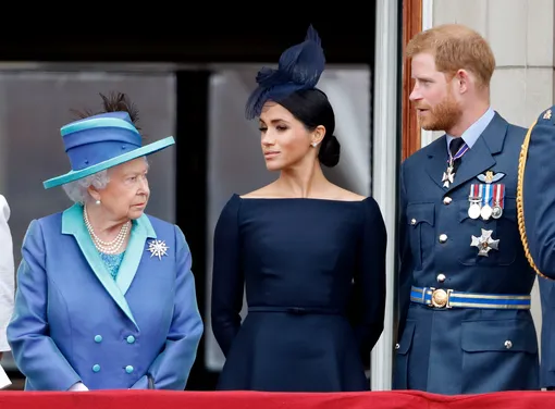 Елизавета II с принцем Гарри и Меган Маркл, 2018