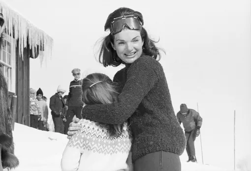 (Original Caption) Mrs. Jacqueline Kennedy laughs and embraces her daughter, Caroline, as the Kennedy family enjoys a ski holiday.