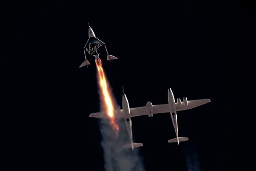 Virgin Galactic's passenger rocket plane VSS Unity, carrying Richard Branson and crew, begins its ascent to the edge of space above Spaceport America near Truth or Consequences, New Mexico, U.S. July 11, 2021 in a still image from video.