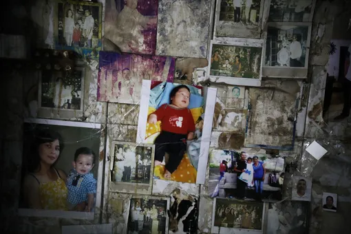 Narcos paste pictures of loved ones to the walls of the Malverde shrine to ask him to protect those still living, and to bless those already dead.